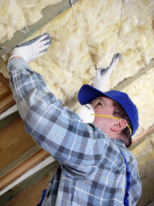 Asbestos Abatement Contractor- man checking on asbestos in attic